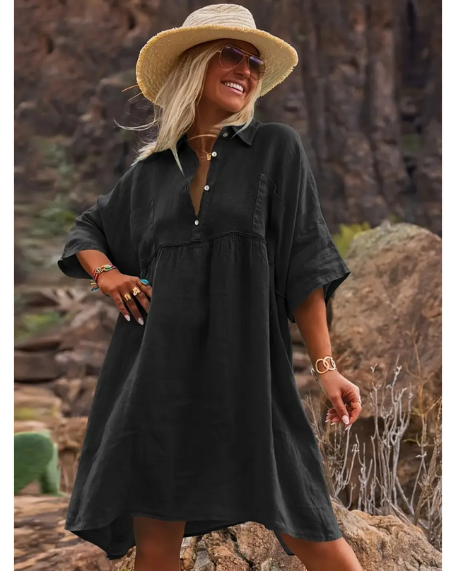 Black linen dress for women by Sogiftme featuring relaxed fit and button-up collar worn outdoors