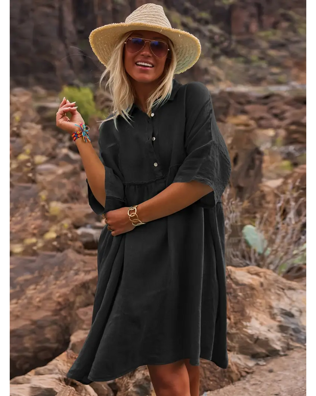 Sogiftme black linen dress for women worn with straw hat and sunglasses in outdoor rocky setting