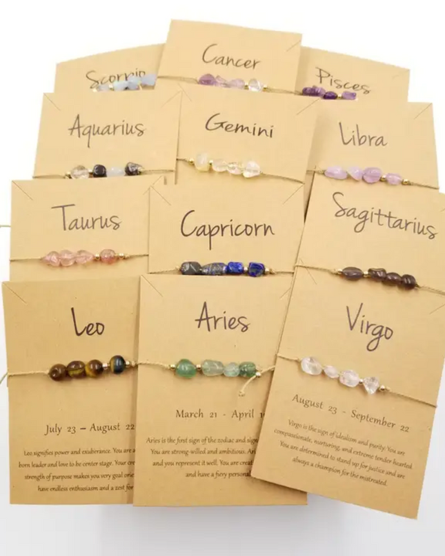 Zodiac constellation bracelet collection by Chakra Jewelry with gemstone beads and handwritten zodiac signs