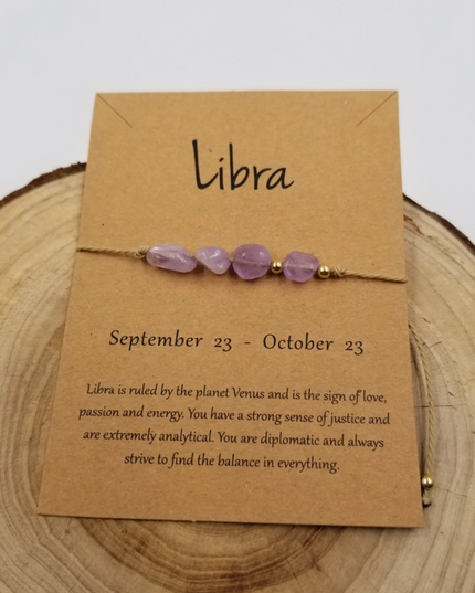 Chakra Jewelry Libra zodiac constellation bracelet with purple stones on a brown card