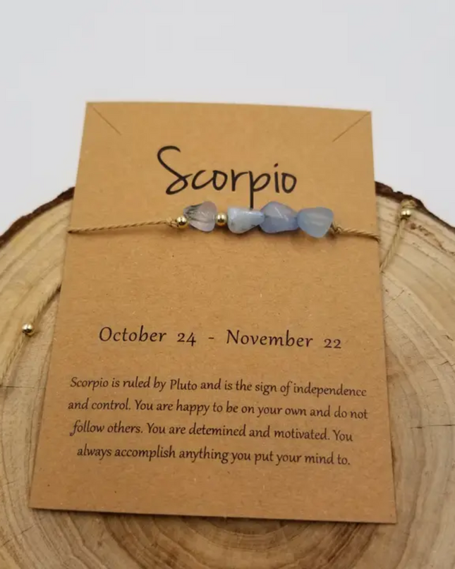 Chakra Jewelry Scorpio zodiac constellation bracelet with blue stone beads on tan card